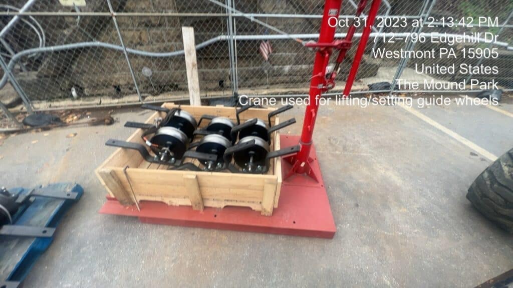 Crane used for lifting/setting guide wheels