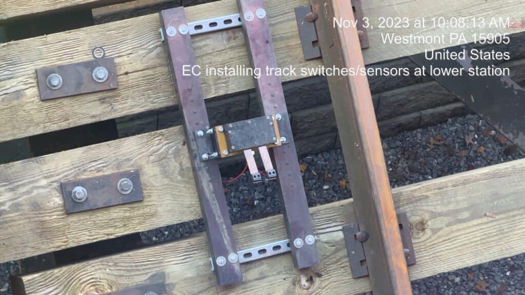 EC installing track switches/sensors at lower station